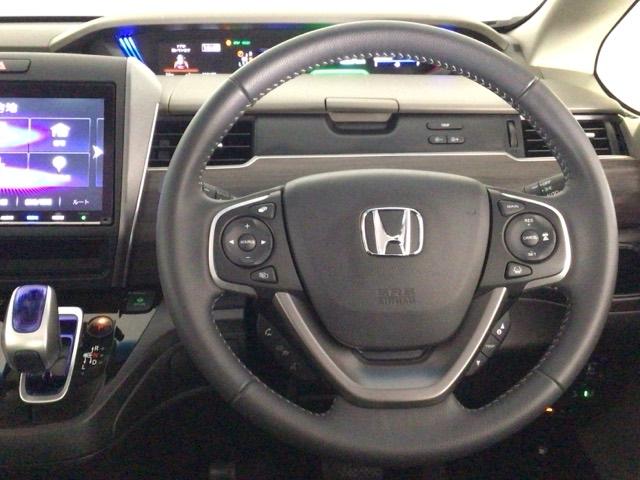 フリードハイブリッド ハイブリッド・ＥＸ　ＬＥＤ・フルセグ・メモリナビ・バックカメラ・純正ＡＷ・シートヒーター・ＥＴＣ　地デジフルセグＴＶ　シ－トヒ－タ－　リヤカメラ　ＬＥＤライト　フルオートエアコン　ＡＢＳ　ＤＶＤ再生可　ウォークスルー（12枚目）