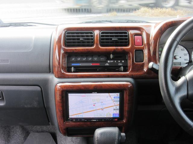 ジムニー ＦＩＳフリースタイルワールドカップリミテッド　切替４ＷＤ／ターボ／社外ＳＤナビ／地デジＴＶ／キーレス／背面ハードカバー／シートヒーター／ウインカー付きドアミラー／修復歴無（19枚目）