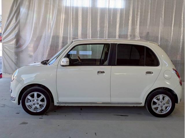 ミラジーノ プレミアムX 社外フルセグナビ Bluetooth フロア4速AT ハーフレザーシート オートエアコン ABS キーレスエントリー 盗難警報装置 パワステ パワーウィンドウ Wエアバッグ 電動格納ミラー 純正アルミ(11枚目)