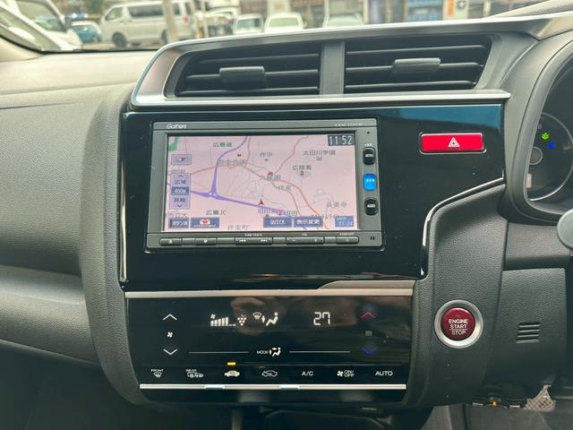 フィット １３Ｇ・Ｆパッケージ　ファインエディション　４ＷＤ　ＥＴＣ　バックカメラ　ナビ　ＴＶ　アルミホイール　スマートキー　アイドリングストップ　シートヒーター　フルフラット　ＣＶＴ　盗難防止システム　衝突安全ボディ　ＡＢＳ　ＥＳＣ（4枚目）