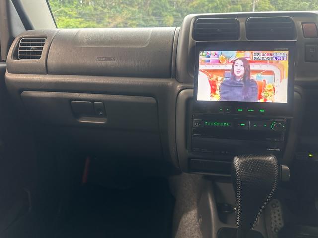 ジムニー ワイルドウインド　ルーフキャリア　ＥＴＣ　専用カバー付き背面タイヤ　フォグランプ　シートヒーター　ターボ　ミラーヒーター　４速ＡＴ　キーレス　ナビ　フルセグＴＶ　純正１６インチアルミホイール（4枚目）