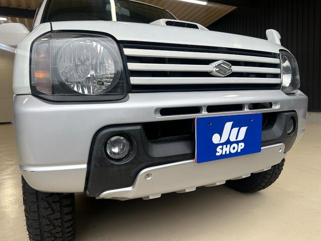 ジムニー ワイルドウインド　ルーフキャリア　ＥＴＣ　専用カバー付き背面タイヤ　フォグランプ　シートヒーター　ターボ　ミラーヒーター　４速ＡＴ　キーレス　ナビ　フルセグＴＶ　純正１６インチアルミホイール（8枚目）