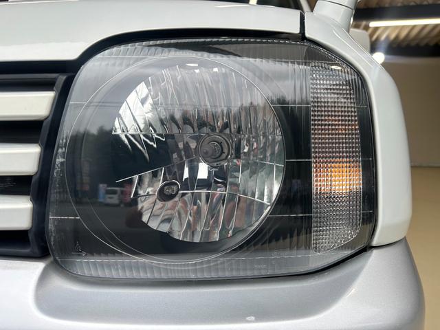 ジムニー ワイルドウインド　ルーフキャリア　ＥＴＣ　専用カバー付き背面タイヤ　フォグランプ　シートヒーター　ターボ　ミラーヒーター　４速ＡＴ　キーレス　ナビ　フルセグＴＶ　純正１６インチアルミホイール（11枚目）