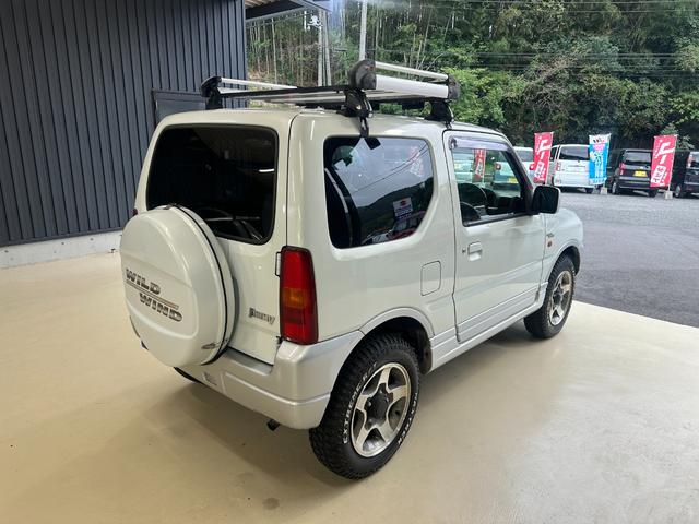 ジムニー ワイルドウインド　ルーフキャリア　ＥＴＣ　専用カバー付き背面タイヤ　フォグランプ　シートヒーター　ターボ　ミラーヒーター　４速ＡＴ　キーレス　ナビ　フルセグＴＶ　純正１６インチアルミホイール（14枚目）