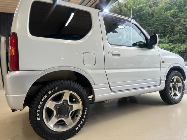 ジムニー ワイルドウインド　ルーフキャリア　ＥＴＣ　専用カバー付き背面タイヤ　フォグランプ　シートヒーター　ターボ　ミラーヒーター　４速ＡＴ　キーレス　ナビ　フルセグＴＶ　純正１６インチアルミホイール（22枚目）