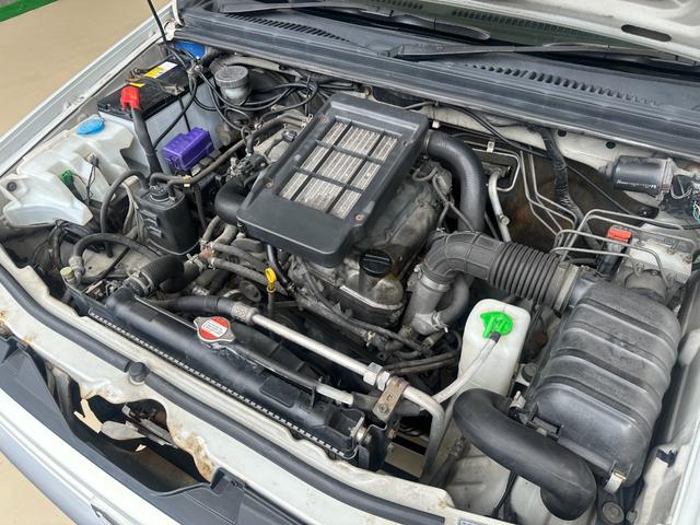 ジムニー ワイルドウインド　ルーフキャリア　ＥＴＣ　専用カバー付き背面タイヤ　フォグランプ　シートヒーター　ターボ　ミラーヒーター　４速ＡＴ　キーレス　ナビ　フルセグＴＶ　純正１６インチアルミホイール（25枚目）