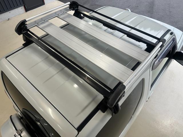 ジムニー ワイルドウインド　ルーフキャリア　ＥＴＣ　専用カバー付き背面タイヤ　フォグランプ　シートヒーター　ターボ　ミラーヒーター　４速ＡＴ　キーレス　ナビ　フルセグＴＶ　純正１６インチアルミホイール（27枚目）