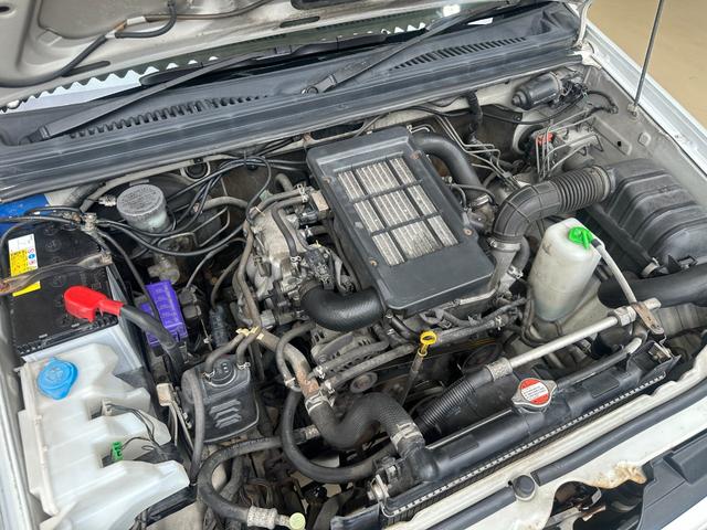 ジムニー ワイルドウインド　ルーフキャリア　ＥＴＣ　専用カバー付き背面タイヤ　フォグランプ　シートヒーター　ターボ　ミラーヒーター　４速ＡＴ　キーレス　ナビ　フルセグＴＶ　純正１６インチアルミホイール（32枚目）