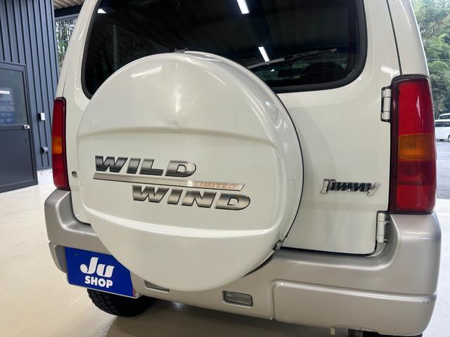 ジムニー ワイルドウインド　ルーフキャリア　ＥＴＣ　専用カバー付き背面タイヤ　フォグランプ　シートヒーター　ターボ　ミラーヒーター　４速ＡＴ　キーレス　ナビ　フルセグＴＶ　純正１６インチアルミホイール（44枚目）