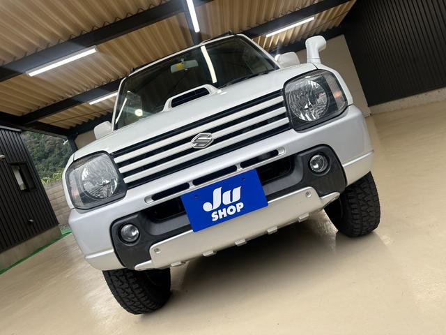 ジムニー ワイルドウインド　ルーフキャリア　ＥＴＣ　専用カバー付き背面タイヤ　フォグランプ　シートヒーター　ターボ　ミラーヒーター　４速ＡＴ　キーレス　ナビ　フルセグＴＶ　純正１６インチアルミホイール（47枚目）