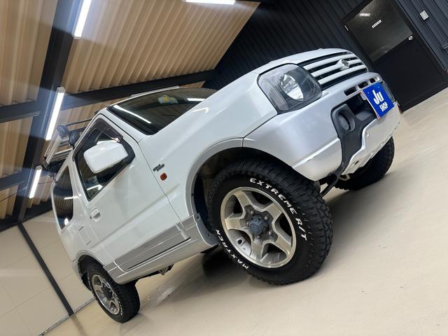 ジムニー ワイルドウインド　ルーフキャリア　ＥＴＣ　専用カバー付き背面タイヤ　フォグランプ　シートヒーター　ターボ　ミラーヒーター　４速ＡＴ　キーレス　ナビ　フルセグＴＶ　純正１６インチアルミホイール（48枚目）