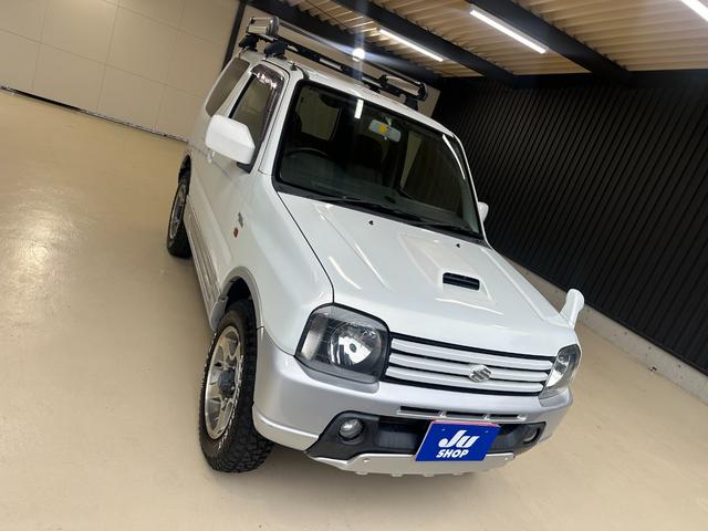 ジムニー ワイルドウインド　ルーフキャリア　ＥＴＣ　専用カバー付き背面タイヤ　フォグランプ　シートヒーター　ターボ　ミラーヒーター　４速ＡＴ　キーレス　ナビ　フルセグＴＶ　純正１６インチアルミホイール（55枚目）