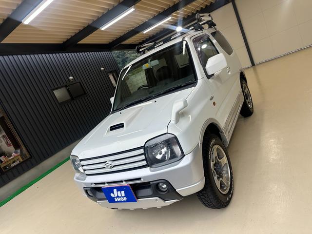 ジムニー ワイルドウインド　ルーフキャリア　ＥＴＣ　専用カバー付き背面タイヤ　フォグランプ　シートヒーター　ターボ　ミラーヒーター　４速ＡＴ　キーレス　ナビ　フルセグＴＶ　純正１６インチアルミホイール（57枚目）