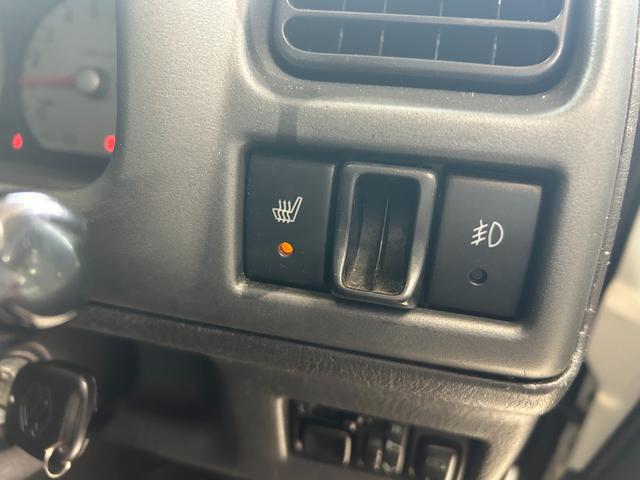 ジムニー ワイルドウインド　ルーフキャリア　ＥＴＣ　専用カバー付き背面タイヤ　フォグランプ　シートヒーター　ターボ　ミラーヒーター　４速ＡＴ　キーレス　ナビ　フルセグＴＶ　純正１６インチアルミホイール（62枚目）