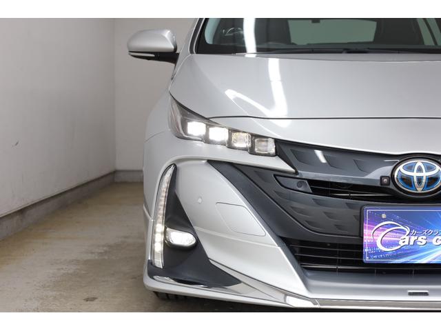 プリウスＰＨＶ Ａ　後期型　５人乗り　寒冷地仕様　モデリスタフルエアロ　改良後セーフティセンス　純正９型ＳＤナビ　全方位カメラ　ＩＣＳ　ＢＳＭ　禁煙車　モデリスタ１５インチＡＷ　ＡＣ１５００Ｗ　置くだけ充電　パワーシート（28枚目）