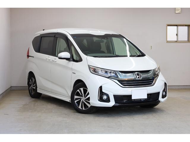 フリードハイブリッド ハイブリッド・ＥＸ　両側電動スライドドア　ホンダセンシング　禁煙車　純正メモリーナビ　アップルカープレイ　バックカメラ　シートヒーター　純正１５インチＡＷ　レーダークルーズ　後席サンシェード　ＬＥＤヘッドライト　ＥＴＣ（2枚目）