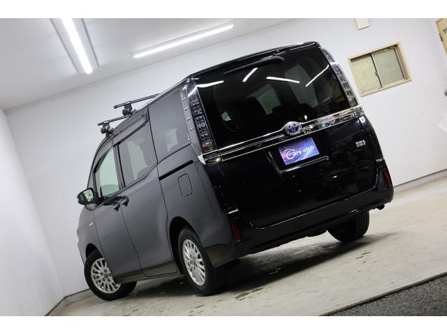 ヴォクシー ハイブリッドＶ　ワンオーナー　アルパイン１０型ＳＤナビ　Ｂカメラ　電動スライドドア　左右独立ＡＡＣ　リヤエアコン　後席サンシェード　シートヒーター　クルーズコントロール　ＥＴＣ　純正１５インチＡＷ　ＬＥＤヘッドライト（11枚目）