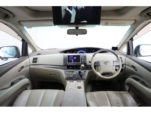 エスティマハイブリッド Ｇレザーパッケージ　４ＷＤ　大型サンルーフ　本革シート　両側電動スライドドア　電動床下格納機能　禁煙　純正８型ＨＤＤナビ　純正後席モニター　純正１７インチＡＷ　Ｗエアコン　ＡＣ１５００Ｗ　オットマン　クルーズコントロール（4枚目）