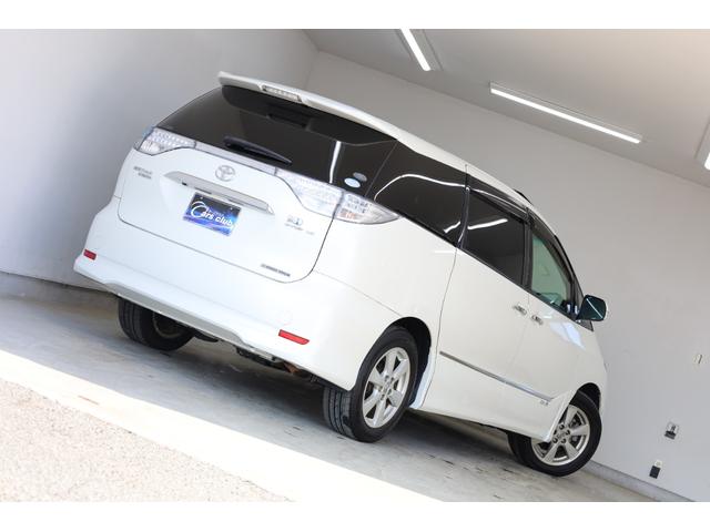 エスティマハイブリッド Ｇレザーパッケージ　４ＷＤ　大型サンルーフ　本革シート　両側電動スライドドア　電動床下格納機能　禁煙　純正８型ＨＤＤナビ　純正後席モニター　純正１７インチＡＷ　Ｗエアコン　ＡＣ１５００Ｗ　オットマン　クルーズコントロール（12枚目）