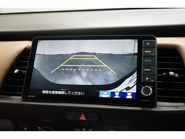 フィット ｅ：ＨＥＶリュクス　禁煙車　ホンダセンシング　Ｇａｔｈｅｒｓ製９インチナビ　バックカメラ　衝突軽減　レーダークルーズ　ハーフレザー　スマートキー　ＥＴＣ　フルセグＴＶ　ＣＤ／ＤＶＤ再生　Ｂｌｕｅｔｏｏｔｈ接続　点検記録簿（6枚目）