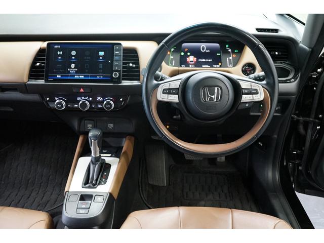 フィット ｅ：ＨＥＶリュクス　禁煙車　ホンダセンシング　Ｇａｔｈｅｒｓ製９インチナビ　バックカメラ　衝突軽減　レーダークルーズ　ハーフレザー　スマートキー　ＥＴＣ　フルセグＴＶ　ＣＤ／ＤＶＤ再生　Ｂｌｕｅｔｏｏｔｈ接続　点検記録簿（30枚目）