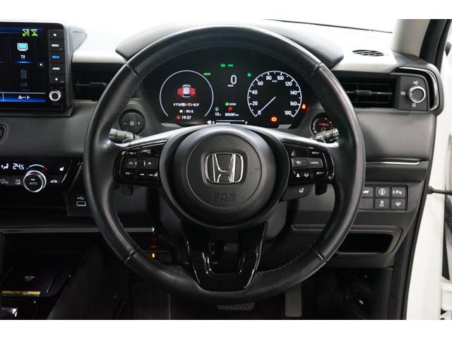 ヴェゼル ｅ：ＨＥＶ　Ｚ　禁煙車　ワンオーナー　９型ナビＴＶ　バックカメラ　衝突軽減ブレーキ　ＣＭＢＳ　レーダークルーズ　ハーフ革　ＥＴＣ　ＣＤ／ＤＶＤ　Ｂｌｕｅｔｏｏｔｈ接続　電動リアゲート　シートヒーター　ホンダセンシング（9枚目）