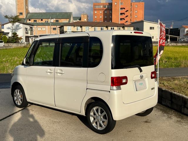 タント Ｌ　ワンオーナー　純正アルミ　コインポケット　リア席フラット　スライドドア　純正オーディオ　ハイトワゴン　アームレストコンソール　ドリンクホルダー　エアコン　パワステ　キーレス　スペアキー　保証書（11枚目）