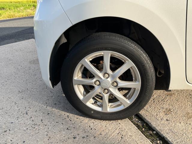 タント Ｌ　ワンオーナー　純正アルミ　コインポケット　リア席フラット　スライドドア　純正オーディオ　ハイトワゴン　アームレストコンソール　ドリンクホルダー　エアコン　パワステ　キーレス　スペアキー　保証書（16枚目）