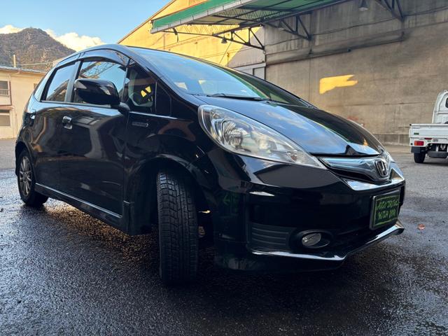 フィットハイブリッド ＲＳ　社外ナビ・フルセグＴＶ・バックカメラ・ビルトインＥＴＣ・前後ドライブレコーダー・キセノンヘッドライト・クルーズコントロール・オートライト・スマートキー２個・電動格納ミラーウィンカー・１５インチアルミ（4枚目）