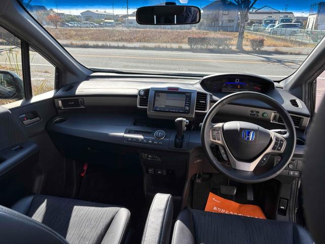 フリードスパイクハイブリッド ジャストセレクション ハイブリッド ETC バックカメラ ナビ TV 両側電動スライドドア オートクルーズコントロール オートライト HID スマートキー 電動格納ミラー CVT 盗難防止システム 衝突安全ボディ(2枚目)