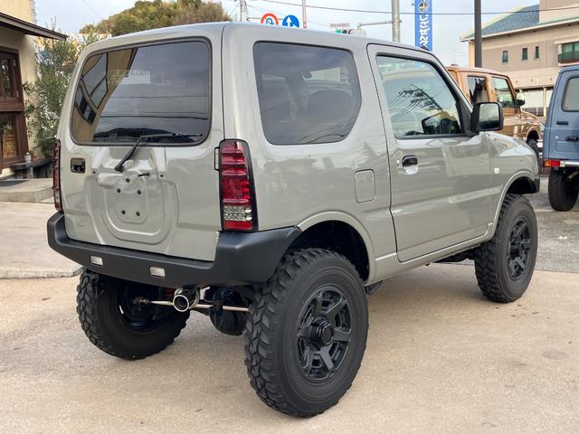 ジムニー ＸＣ　リフトアップ　社外マフラー　社外１６インチアルミ　社外ステアリング　５速ＭＴ　新品Ｂｌｕｅｔｏｏｔｈオーディオ　キーレス（13枚目）