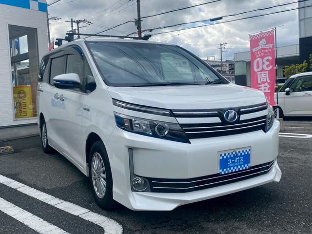 ヴォクシー ハイブリッドＶ　純正９インチナビ／ＴＶ／Ｂｌｕｅｔｏｏｔｈ／バックカメラ／両側パワースライドドア／フリップダウンモニター／純正アルミ／クルーズコントロール／ＥＴＣ／シートヒーター／セーフティーセンス（3枚目）