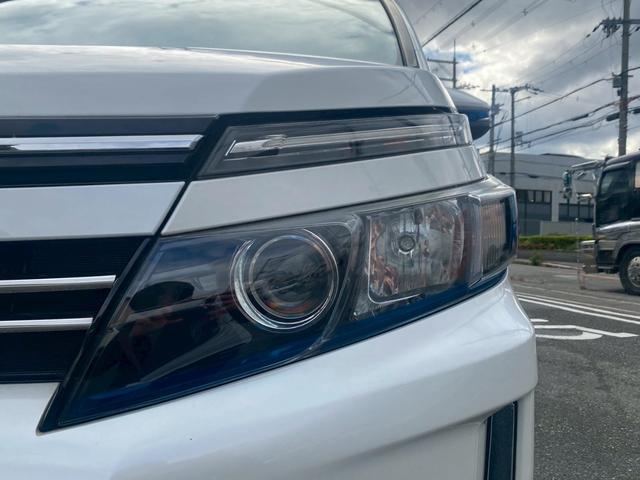 ヴォクシー ハイブリッドＶ　純正９インチナビ／ＴＶ／Ｂｌｕｅｔｏｏｔｈ／バックカメラ／両側パワースライドドア／フリップダウンモニター／純正アルミ／クルーズコントロール／ＥＴＣ／シートヒーター／セーフティーセンス（14枚目）