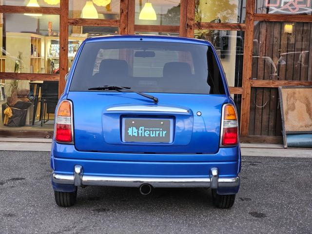 ミラジーノ ミニライトスペシャルターボ 全席取り外し清掃済 ターボ 5MT ローダウン D-SPORTSショック 社外エアクリ オーバーフェンダー メッシュグリル センターマフラー 社外フロントパイプ ショートシフト MOMOステアリング(6枚目)