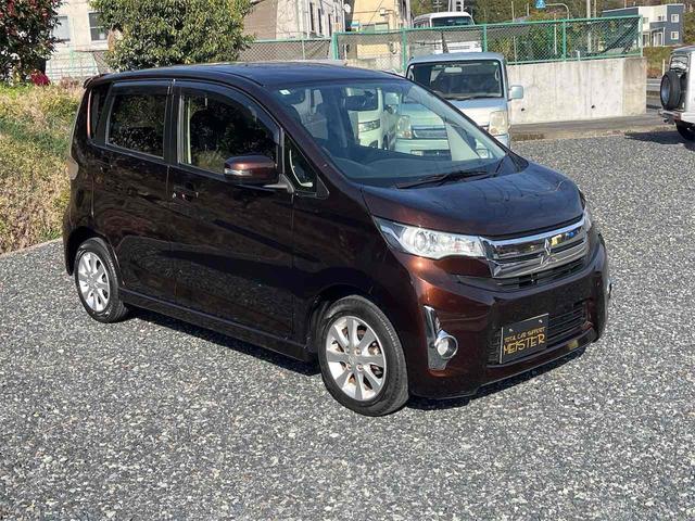 ｅＫカスタム Ｇ　ＥＴＣ　バックカメラ　ナビ　ＨＩＤ　スマートキー　アイドリングストップ　電動格納ミラー　ベンチシート　ＣＶＴ　盗難防止システム　ＡＢＳ　アルミホイール　衝突安全ボディ　エアコン　パワーステアリング（3枚目）