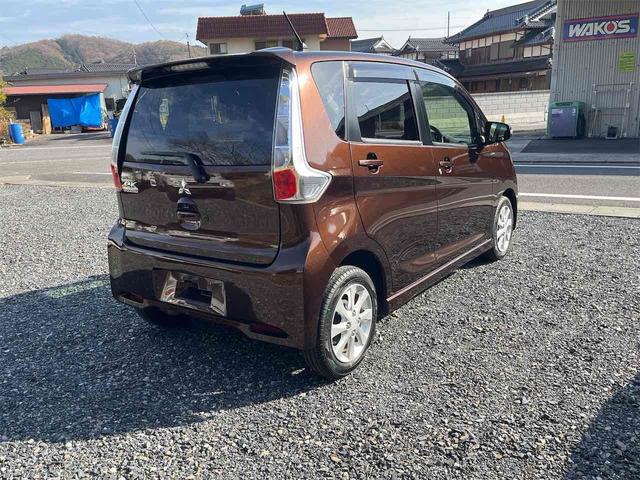 ｅＫカスタム Ｇ　ＥＴＣ　バックカメラ　ナビ　ＨＩＤ　スマートキー　アイドリングストップ　電動格納ミラー　ベンチシート　ＣＶＴ　盗難防止システム　ＡＢＳ　アルミホイール　衝突安全ボディ　エアコン　パワーステアリング（5枚目）