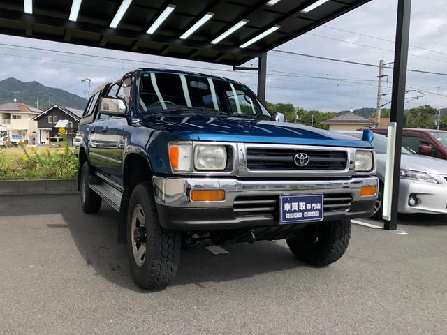 ハイラックスピックアップ ダブルキャブ SSR 4WD/ディーゼル/5MT/4ドア/5人乗り/ETC/エアコン/パワステ/15インチアルミホイール/社外シフトノブ/ドアバイザー/記録簿/取扱説明書(7枚目)