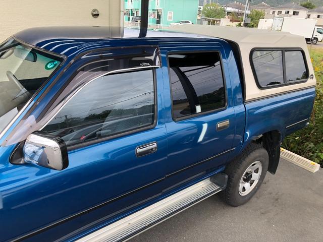 ハイラックスピックアップ ダブルキャブ SSR 4WD/ディーゼル/5MT/4ドア/5人乗り/ETC/エアコン/パワステ/15インチアルミホイール/社外シフトノブ/ドアバイザー/記録簿/取扱説明書(14枚目)