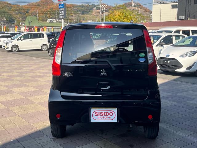 eKワゴン E 社外ナビ 地デジ シートヒーター 格納ミラー キーレスエントリー 横滑り防止 ベンチシート 衝突安全ボディー Wエアバック ABS ヘッドライトレべライザー 禁煙車(32枚目)