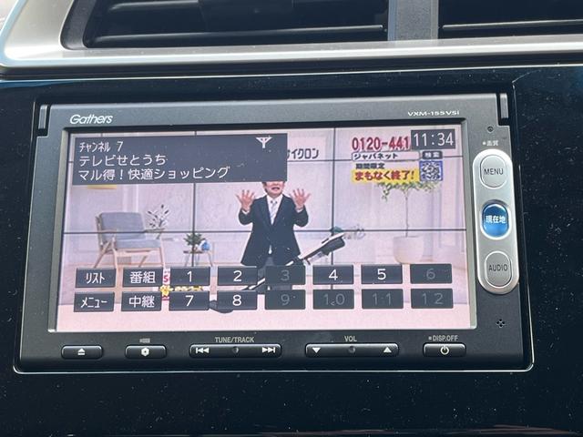 フィットハイブリッド Ｌパッケージ　ナビ　地デジ　Ｂｌｕｅｔｏｏｈ　バックモニター　スマートキー　ＥＴＣ　ハーフレザーシート　ＬＥＤライト　クルーズコントロール　格納ミラー　オートライト　横滑り防止　アイドリングストップ　ＡＢＳ　禁煙車（11枚目）