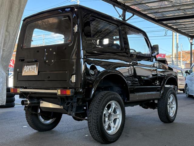 ジムニー HC 全塗装済み V-JA11V改 5MT ターボ 4WD リフトアップ オーバーフェンダー 社外マフラー タニグチリアシートスライドレール MOMOステアリング 社外アルミ 社外足回り 社外シート ETC(4枚目)