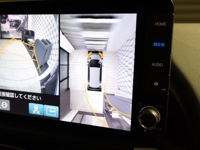 フリード ｅ：ＨＥＶクロスター　登録済未使用車　純正９型ナビＴＶ　マルチビューカメラシステム　両側パワースライドドア　ＬＥＤヘッドライト　ハーフレザーシート　シートヒーター　ブラインドスポットモニター　専用純正アルミ　６人乗り（6枚目）