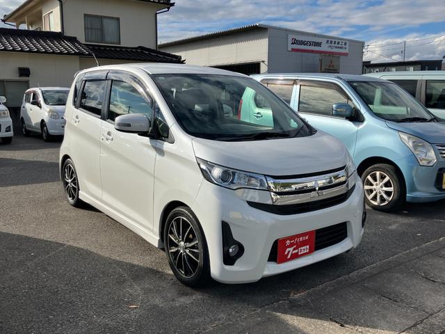 ｅＫカスタム Ｔ　ワンオーナー　禁煙車　フルセグＴＶ　バックカメラ　ミラー型バックモニター　ローダウン　オートライト　社外１５インチアルミホイール　ＣＤ／ＤＶＤ再生可　ＥＴＣ　スマートキー　プッシュスタート（51枚目）
