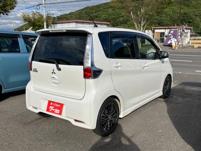 ｅＫカスタム Ｔ　ワンオーナー　禁煙車　フルセグＴＶ　バックカメラ　ミラー型バックモニター　ローダウン　オートライト　社外１５インチアルミホイール　ＣＤ／ＤＶＤ再生可　ＥＴＣ　スマートキー　プッシュスタート（54枚目）