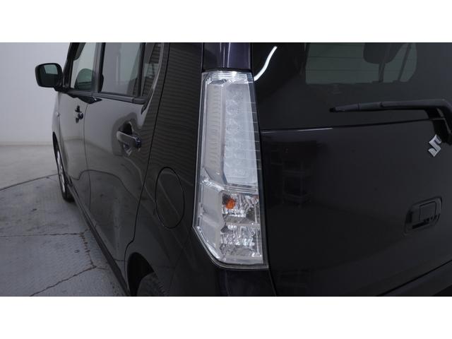 ワゴンＲスティングレー Ｘ　禁煙車　オーディオ　スマートキー　革巻きハンドル　アームレスト　チルトステアリング　シートリフター　ＨＩＤヘッドライト　ＡＵＴＯエアコン　電動格納ドアミラー　純正１４インチアルミホイール（60枚目）