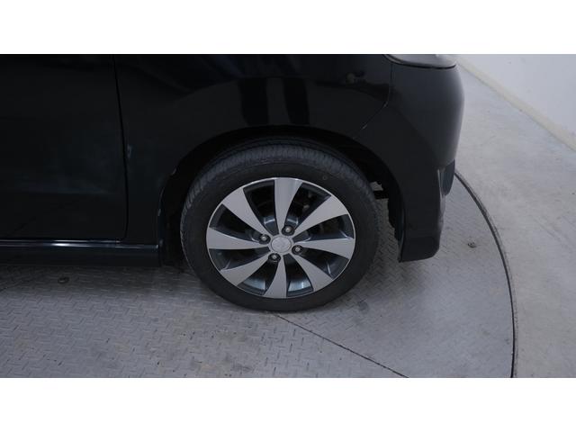 ワゴンＲスティングレー リミテッドＩＩ　禁煙車　スマートキー　プッシュスタート　インパネＡＴ　ベンチシート　アームレスト　ＨＩＤヘッドライト　革巻きハンドル　　シートヒーター　助手席下収納　電動格納ドアミラー　純正１５インチアルミホイール（51枚目）