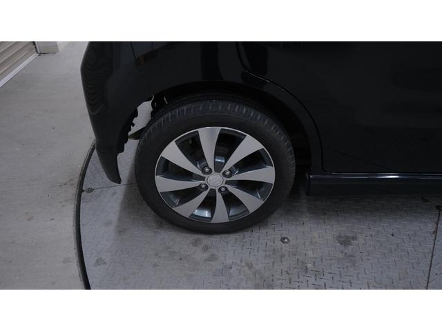 ワゴンＲスティングレー リミテッドＩＩ　禁煙車　スマートキー　プッシュスタート　インパネＡＴ　ベンチシート　アームレスト　ＨＩＤヘッドライト　革巻きハンドル　　シートヒーター　助手席下収納　電動格納ドアミラー　純正１５インチアルミホイール（52枚目）