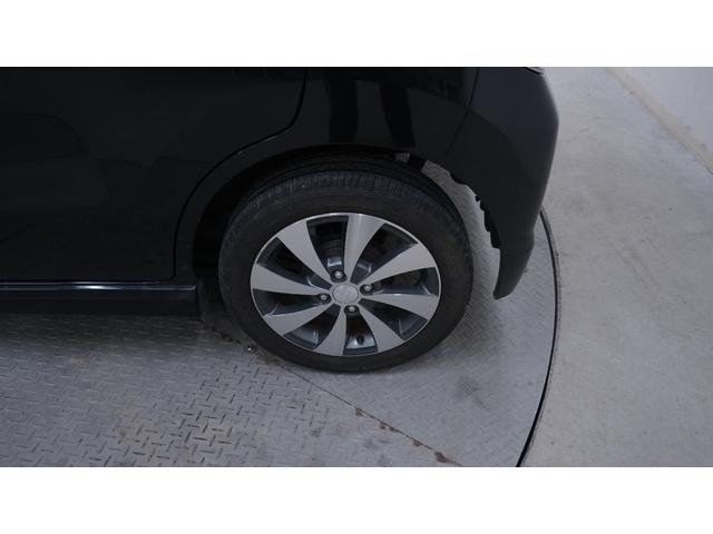 ワゴンＲスティングレー リミテッドＩＩ　禁煙車　スマートキー　プッシュスタート　インパネＡＴ　ベンチシート　アームレスト　ＨＩＤヘッドライト　革巻きハンドル　　シートヒーター　助手席下収納　電動格納ドアミラー　純正１５インチアルミホイール（60枚目）