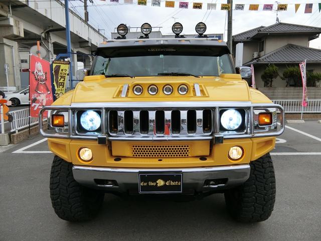 ベースグレード 左H 4WD 外20AW リフトアップ 外マフラー 背面タイヤ HID 大型4連フォグ 後席モニター サンルーフ 黒本革 PWシート シートH HDDナビ フルセグTV バックカメラ メッキパーツ(2枚目)