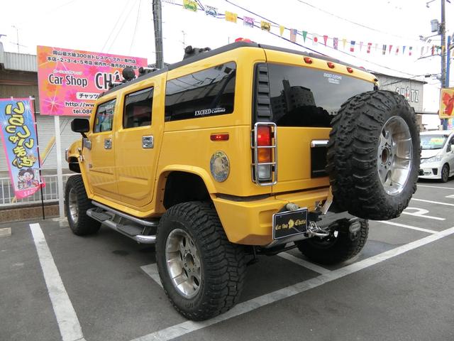 ベースグレード 左H 4WD 外20AW リフトアップ 外マフラー 背面タイヤ HID 大型4連フォグ 後席モニター サンルーフ 黒本革 PWシート シートH HDDナビ フルセグTV バックカメラ メッキパーツ(6枚目)